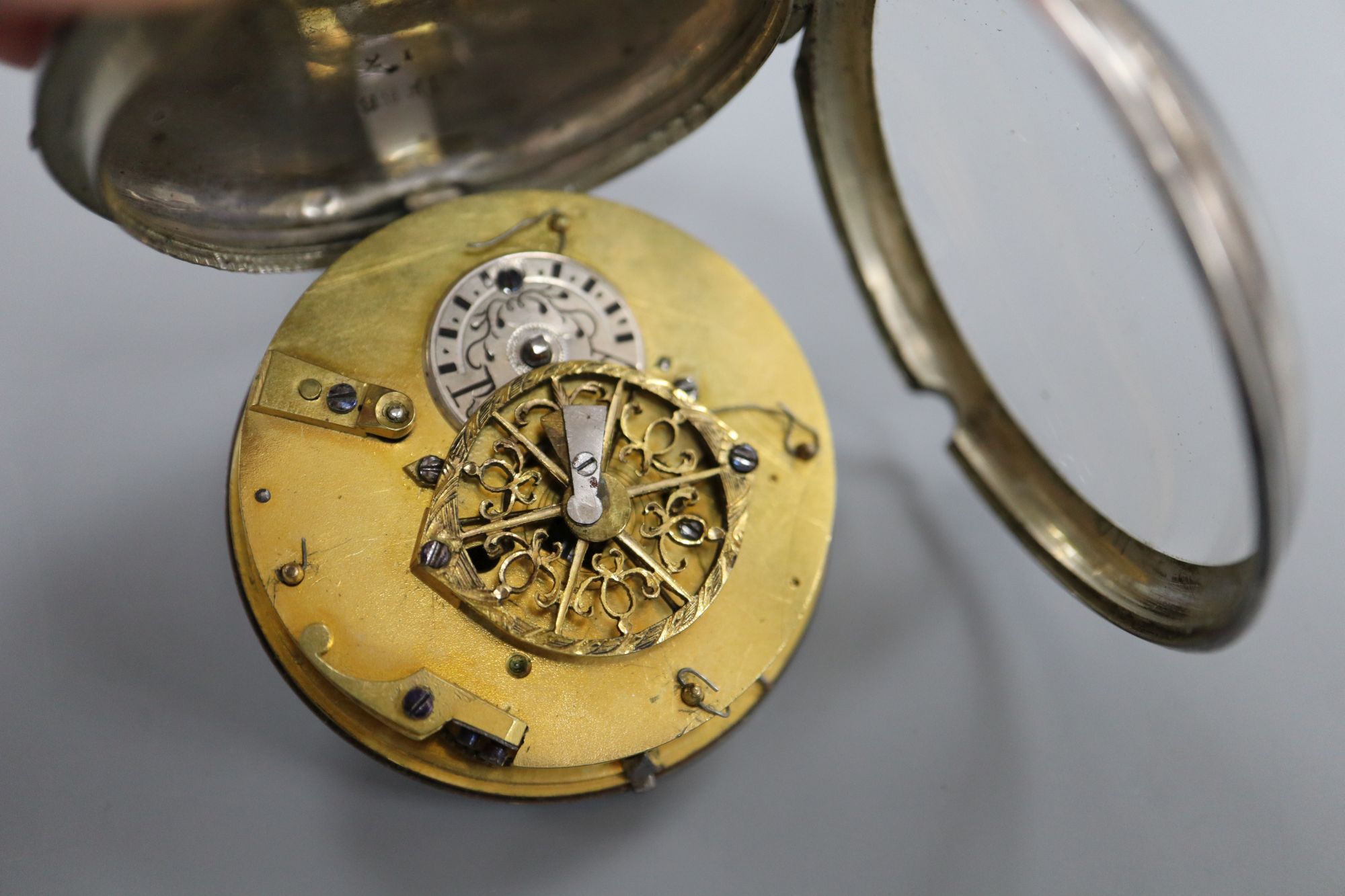 An early 19th century French? white metal pair cased(outer case missing) keywind verge pocket watch,
